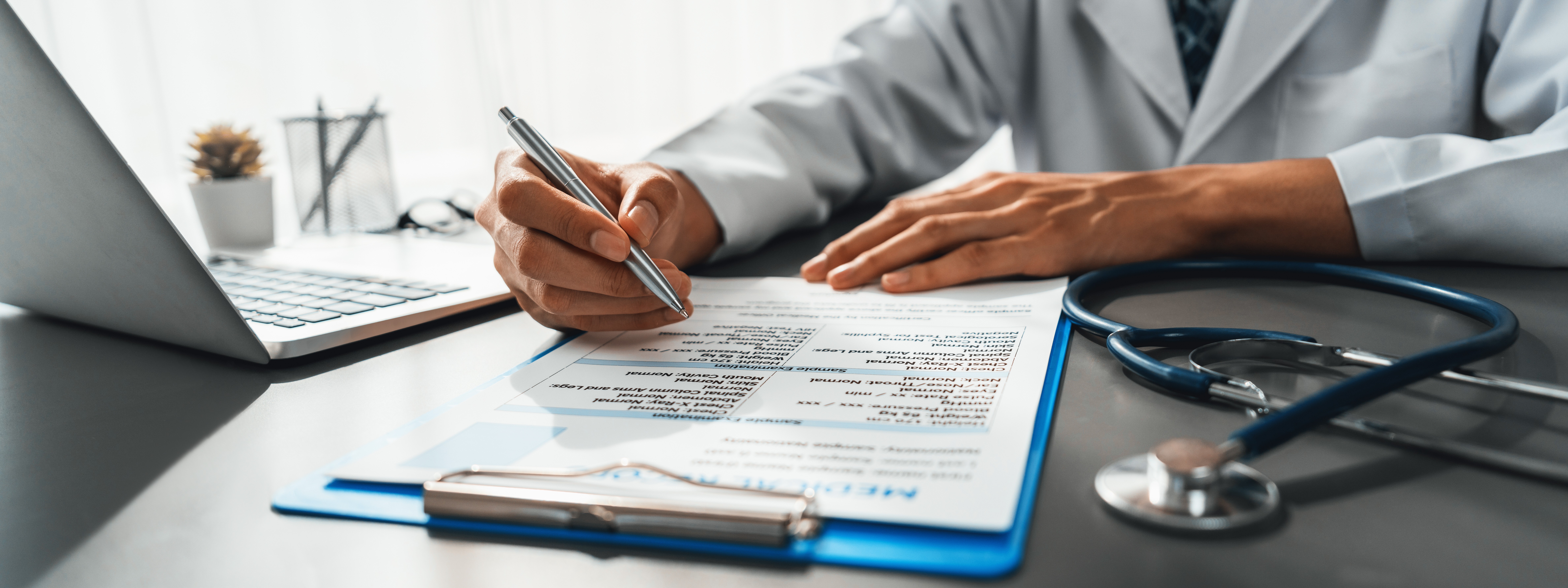 Physician annotating a medical report